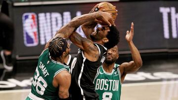 NEW YORK, NEW YORK - MAY 22: Kyrie Irving #11 of the Brooklyn Nets is fouled by Marcus Smart #36 of the Boston Celtics as Kemba Walker #8 of the Boston Celtics defends in the fourth quarter during Game One of their Eastern Conference first-round playoff series on May 22, 2021 at Barclays Center in the Brooklyn borough of New York City. NOTE TO USER: User expressly acknowledges and agrees that, by downloading and or using this photograph, User is consenting to the terms and conditions of the Getty Images License Agreement.   Elsa/Getty Images/AFP
 == FOR NEWSPAPERS, INTERNET, TELCOS &amp; TELEVISION USE ONLY ==