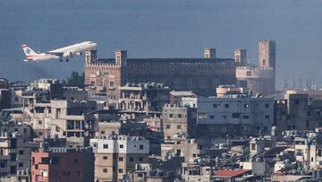 A Lebanese Middle East Airlines (MEA) plane takes off from Beirut-Rafic Hariri International Airport, as smoke rises over Dahiyeh in Beirut's southern suburbs after overnight Israeli air strikes, amid ongoing hostilities between Hezbollah and Israeli forces, as seen from Sin El Fil, Lebanon, October 7, 2024. REUTERS/Amr Abdallah Dalsh