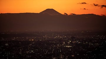 Mount Fuji, Japan&#039;s highest mountain at 3,776 meters (12,388 feet), is pictured from Shibuya Sky observation deck in Tokyo on January 13, 2021 under a state of emergency over the Covid-19 coronavirus pandemic. (Photo by Philip FONG / AFP)