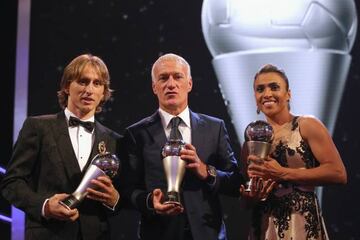 Luka Modric, Didier Deschamps and Marta pose for a photo with their awards during The Best FIFA Football Awards 2018.