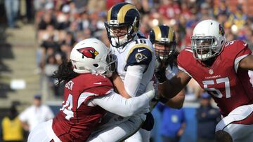 Jan 1, 2017; Los Angeles, CA, USA; Los Angeles Rams quarterback Jared Goff (16) is sacked by Arizona Cardinals inside linebacker Sio Moore (54) and outside linebacker Alex Okafor (57) in the first quarter during a NFL football game at Los Angeles Memorial Coliseum. Mandatory Credit: Kirby Lee-USA TODAY Sports