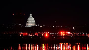 Emergency personnel work near the site of the crash, with the U.S. Capitol in the background, after American Eagle flight 5342 collided with a Black Hawk helicopter while approaching Ronald Reagan Washington National Airport and crashed in the Potomac River, U.S. January 30, 2025. REUTERS/Nathan Howard