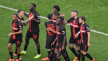 Bayer Leverkusen's German midfielder #08 Robert Andrich (2nd R) celebrates his 2-0 with teammates during the German first division Bundesliga football match between Bayer 04 Leverkusen and FC Augsburg in Leverkusen, western Germany on May 18, 2024. (Photo by Sascha Schuermann / AFP) / DFL REGULATIONS PROHIBIT ANY USE OF PHOTOGRAPHS AS IMAGE SEQUENCES AND/OR QUASI-VIDEO