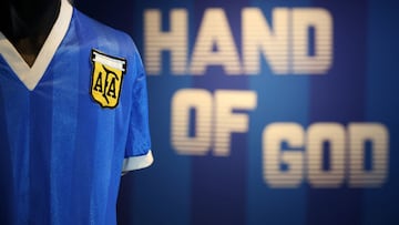 A football shirt worn by Argentina's Diego Maradona during the 1986 World Cup quarter-final match against England, is pictured during a photocall at Sotheby's auction house in London on April 20, 2022, ahead of its sale. -