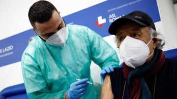 A person receives a dose of the Moderna vaccine against the coronavirus disease (COVID-19), on the day the government is expected to approve new rules for schools and COVID-19 vaccination for workers, at the Music Auditorium in Rome, Italy, January 5, 2022. REUTERS/Guglielmo Mangiapane