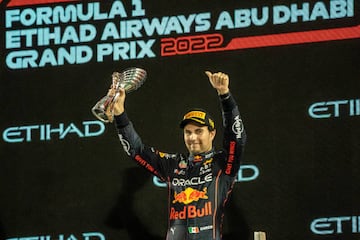 ABU DHABI, UAE - NOVEMBER 20: Third place winner Sergio Perez of Red Bull celebrates on the podium during the F1 Grand Prix of Abu Dhabi at Yas Marina Circuit in Abu Dhabi, United Arab Emirates, November 20, 2022 (Photo by Mohamed Zarandah/Anadolu Agency via Getty Images)