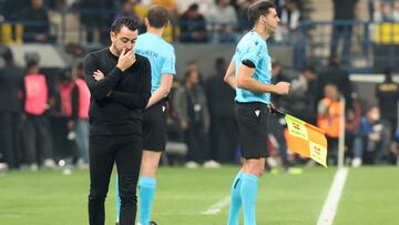 Barcelona's Spanish coach Xavi reacts during the Spanish Super Cup final football match between Real Madrid and Barcelona at the Al-Awwal Park Stadium in Riyadh, on January 14, 2024. (Photo by Giuseppe CACACE / AFP)