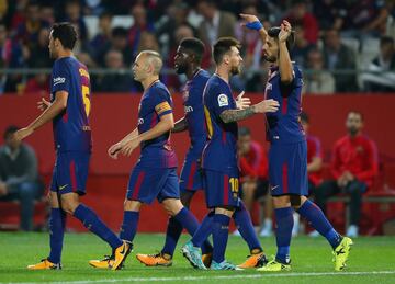 Barcelona's players celebrate Suárez's strike.