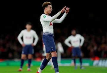 Tottenham's Dele Alli gestures to the Arsenal fans during the match