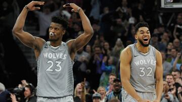 MINNEAPOLIS, MN - APRIL 11: Jimmy Butler #23 and Karl-Anthony Towns #32 of the Minnesota Timberwolves celebrate in the final minute of overtime of the game against the Denver Nuggets on April 11, 2018 at the Target Center in Minneapolis, Minnesota. The Ti