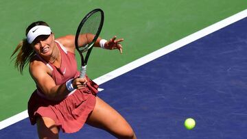 Paula Badosa of Spain hits a forehand return to Veronika Kudermetova of Russia during their WTA quarter-final match at the Indian Wells tennis tournament on March 17, 2022 in Indian Wells, California. (Photo by Frederic J. BROWN / AFP)