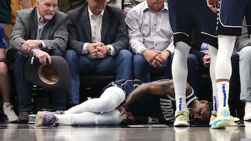 Kyrie Irving #11 of the Dallas Mavericks lies on the court after suffering an injury in the first half against the Sacramento Kings at American Airlines Center on March 03, 2025 in Dallas, Texas.