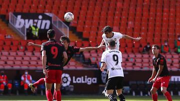 VALENCIA, SPAIN - APRIL 11: Gabriel Paulista of Valencia CF scores their team&#039;s second goal during the La Liga Santander match between Valencia CF and Real Sociedad at Estadio Mestalla on April 11, 2021 in Valencia, Spain. Sporting stadiums around Sp