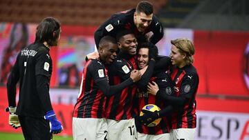 AC Milan players celebrate after AC Milan&#039;s Turkish midfielder Hakan Calhanoglu (2ndR)scored the winning penalty in the penalty shootout during the Italian Cup (Coppa Italia) round of sixteen football match AC Milan vs Torino on January 12, 2021 at t