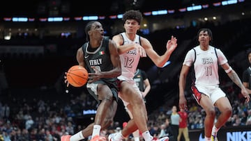 Dame Sarr #2 of Team World goes to the basket against Cameron Boozer #12 of Team USA during the 2025 Nike Hoop Summit at Moda Center on April 12, 2025 in Portland, Oregon.