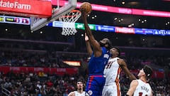 Jan 1, 2024; Los Angeles, California, USA; Los Angeles Clippers guard James Harden (1) shoots a layup against Miami Heat center Thomas Bryant (31), guard Tyler Herro (14), and forward Jaime Jaquez Jr. (11) during the second quarter at Crypto.com Arena. Mandatory Credit: Jonathan Hui-USA TODAY Sports