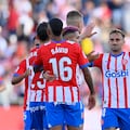 Girona's Ukrainian forward #09 Artem Dovbyk celebrates with teammates scoring his team's third goal during the Spanish league football match between Girona FC and UD Almeria at the Montilivi stadium in Girona on October 22, 2023. (Photo by Pau BARRENA / AFP)
