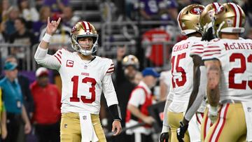 MINNEAPOLIS, MINNESOTA - OCTOBER 23: Brock Purdy #13 of the San Francisco 49ers signals to the sideline while playing the Minnesota Vikings at U.S. Bank Stadium on October 23, 2023 in Minneapolis, Minnesota.   Stephen Maturen/Getty Images/AFP (Photo by Stephen Maturen / GETTY IMAGES NORTH AMERICA / Getty Images via AFP)