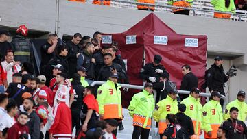 Police and firefighters work at the site where a spectator fell from the top of a grandstand during the 2023 Argentine Professional Football League Tournament match between River Plate and Defensa y Justicia at the El Monumental stadium, in Buenos Aires, on June 3, 2023. (Photo by ALEJANDRO PAGNI / AFP)