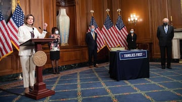 US House Speaker Nancy Pelosi speaks to the press before signing the additional 484 billion dollar relief package amid the coronavirus pandemic with Finance Committee chair Maxine Waters (2nd L), with Ways and Means Committee chair Richard Neal (C), Small