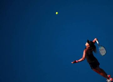 Naomi Osaka serves to Julia Görges in Beijing.