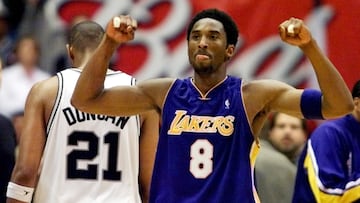 FILE PHOTO: ON THIS DAY -- May 21  May 21, 2001     BASKETBALL - Los Angeles Lakers guard Kobe Bryant celebrates while San Antonio Spurs forward Tim Duncan walks off disconsolately during Game 2 of the Western Conference Finals at the Alamodome in San Antonio.     Duncan's monster 40-point game went in vain as Bryant added 28 points of his own to lead Los Angeles to an 88-81 victory and a 2-0 lead in the series.     The Lakers went on to sweep San Antonio before defeating Philadelphia 76ers 4-1 in the NBA Finals to seal their second straight championship.  REUTERS/Andess Latif/File photo