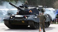 Soldiers look on from a tank, on the day German Defence Minister Boris Pistorius and German President Frank Walter Steinmeier visit a training site where Ukrainian soldiers undergo maintenance training on Leopard 1 A5 tanks, at the German army Bundeswehr base, part of the EU Military Assistance Mission in support of Ukraine (EUMAM UA) in Klietz, Germany, February 23, 2024. REUTERS/Liesa Johannssen