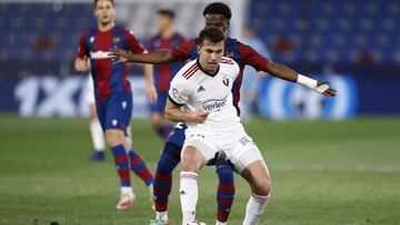 VALENCIA, SPAIN - FEBRUARY 14: Lucas Torro of CA Osasuna is challenged by Mickael Malsa of Levante UD during the La Liga Santander match between Levante UD and C.A. Osasuna at Ciutat de Valencia Stadium on February 14, 2021 in Valencia, Spain. Sporting st