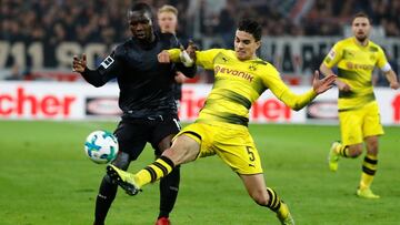 Soccer Football - Bundesliga - VfB Stuttgart vs Borussia Dortmund - Mercedes-Benz Arena, Stuttgart, Germany - November 17, 2017   Borussia Dortmund&rsquo;s Marc Bartra in action with Stuttgart&#039;s Chadrac Akolo   REUTERS/Kai Pfaffenbach    DFL RULES TO LIMIT THE ONLINE USAGE DURING MATCH TIME TO 15 PICTURES PER GAME. IMAGE SEQUENCES TO SIMULATE VIDEO IS NOT ALLOWED AT ANY TIME. FOR FURTHER QUERIES PLEASE CONTACT DFL DIRECTLY AT + 49 69 650050