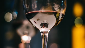 Glass of red wine with lights