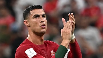 Portugal's forward #07 Cristiano Ronaldo applauds at the crowd after qualifying to the next round after defeating Switzerland 6-1 in the Qatar 2022 World Cup round of 16 football match between Portugal and Switzerland at Lusail Stadium in Lusail, north of Doha on December 6, 2022. (Photo by Anne-Christine POUJOULAT / AFP)