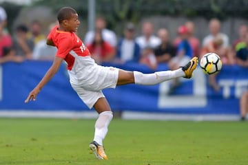 Monaco's French forward Kylian Mbappe reaches out to the ball during a friendly football game between AS Monaco and Fenerbahce SK on July 19, 2017 in Montreux.