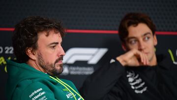 Nov 19, 2025; Las Vegas, NV, USA; Aston Martin Racing driver Fernando Alonso (14) and Mercedes driver George Russell (63) during media availabilities at Las Vegas Strip Circuit. Mandatory Credit: Gary A. Vasquez-Imagn Images