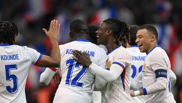 France's forward #12 Randal Kolo Muani celebrates scoring his team's second goal with France's defender #05 Jules Kounde, France's midfielder #06 Eduardo Camavinga and France's forward #10 Kylian Mbappe during the friendly football match between France and Chile at the Stade Velodrome in Marseille, southern France, on March 26, 2024. (Photo by NICOLAS TUCAT / AFP)