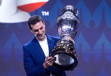Argentina's national soccer team coach Lionel Sebastian Scaloni holds the CONMEBOL Cup during the Copa America 2024 group stage draw 
