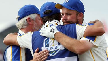 KOHLER, WISCONSIN - SEPTEMBER 26: Shane Lowry of Ireland and team Europe is hugged by Bo Martin and Harry Diamond on the 16th hole during Sunday Singles Matches of the 43rd Ryder Cup at Whistling Straits on September 26, 2021 in Kohler, Wisconsin. Warren
