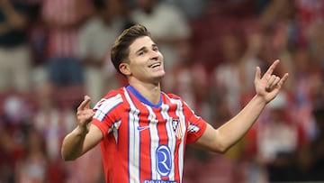 Atletico Madrid's Argentine forward #19 Julian Alvarez celebrates scoring his team's third goal during the Spanish league football match between Club Atletico de Madrid and Valencia CF at the Metropolitano stadium in Madrid on September 15, 2024. (Photo by Pierre-Philippe MARCOU / AFP)