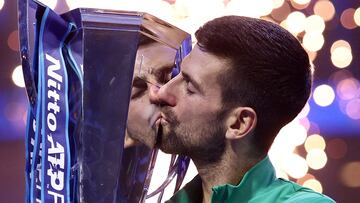 FILE PHOTO: Tennis - ATP Finals - Pala Alpitour, Turin, Italy - November 19, 2023 Serbia's Novak Djokovic celebrates with the trophy after winning the final against Italy's Jannik Sinner REUTERS/Guglielmo Mangiapane TPX IMAGES OF THE DAY/File Photo