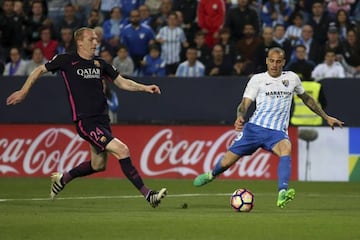 Mathieu can only look in on vain as Sandro puts Málaga ahead.