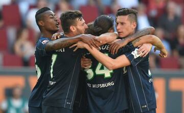 Wolfsburg were missing new signing Mario Gomez but recorded a comfortable opening day win over Augsburg.