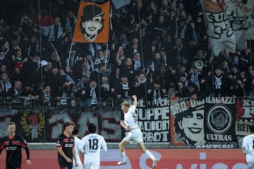 Hugo Larsson celebrates scoring for Eintracht Frankfurt in a UEFA Europa League match against FC Midtjylland.