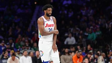 Philadelphia 76ers center Joel Embiid (21) holds his arm after falling against the Toronto Raptors in the second quarter at Wells Fargo Center.