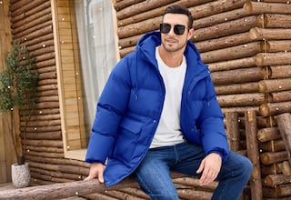 El abrigo largo para hombre que corta el viento, repele el agua y protege con su capucha térmica