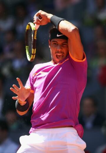 Nadal returns a Djokovic shot at the Caja Mágica