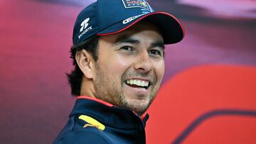 (FILES) Red Bull Racing's Mexican driver Sergio Perez smiles during a press conference ahead of the Qatari Formula One Grand Prix at the Lusail International Circuit in Lusail, north of Doha, on November 28, 2024. Former Red Bull driver Sergio Perez and former Mercedes driver Valtteri Bottas will drive for Cadillac next season, the new Formula One team announced on August 26, 2025. (Photo by Andrej ISAKOVIC / AFP)