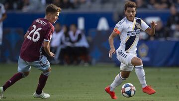 May 19, 2019; Carson, CA, USA; LA Galaxy midfielder Jonathan dos Santos (8) handles the ball while Colorado Rapids midfielder Cole Bassett (26) during the second half at StubHub Center. Mandatory Credit: Kelvin Kuo-USA TODAY Sports