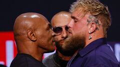 (FILES) Former US boxer Mike Tyson (L) and YouTuber Jake Paul face off during a press conference at the Apollo Theatre in New York, on May 13, 2024. Mike Tyson's upcoming return to the ring against YouTuber Jake Paul has been postponed after the former heavyweight champion's recent health scare, organisers said on May 31, 2024. (Photo by Kena Betancur / AFP)