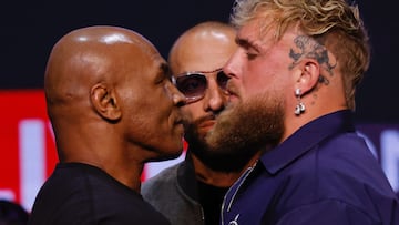 (FILES) Former US boxer Mike Tyson (L) and YouTuber Jake Paul face off during a press conference at the Apollo Theatre in New York, on May 13, 2024. Mike Tyson's upcoming return to the ring against YouTuber Jake Paul has been postponed after the former heavyweight champion's recent health scare, organisers said on May 31, 2024. (Photo by Kena Betancur / AFP)