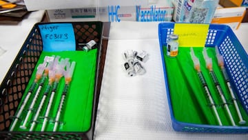 Needles preloaded with the Moderna and Pfizer-BioNTech Covid-19 vaccines sit in baskets awaiting patients at the vaccine clinic at Hartford Hospital in Hartford, Connecticut on August 24, 2021. - According to officials at Hartford HealthCare, booster shot