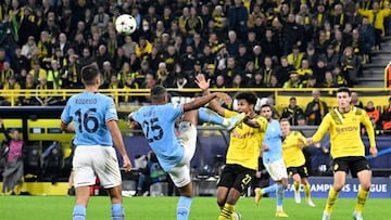 Manchester City's Swiss defender Manuel Akanji (2L) and Dortmund's German forward Karim Adeyemi (C) vie for the ball during the UEFA Champions League Group G football match between Borussia Dortmund and Manchester City in Dortmund, western Germany on October 25, 2022. (Photo by Roberto Pfeil / AFP) (Photo by ROBERTO PFEIL/AFP via Getty Images)